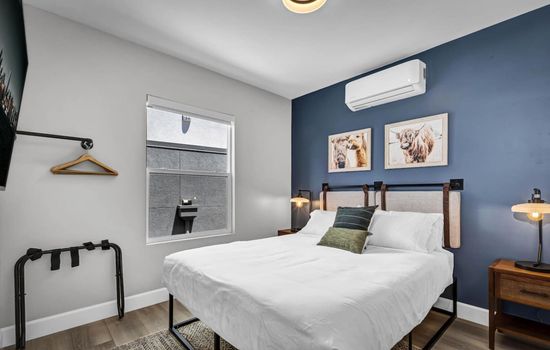 Curl up in comfort and style on the plush queen-size bed.
