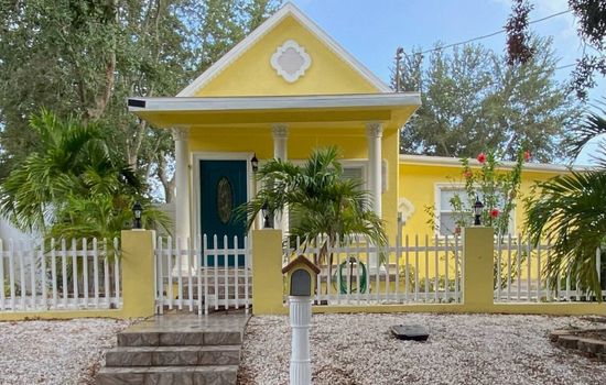 Warning: staring at this cheerful yellow house may cause sudden happiness.