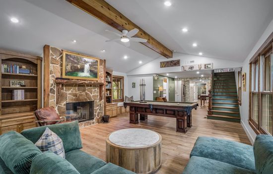 Sink into comfort by the fire, challenge your friends to pool, or binge your favorite shows—this space has it all.