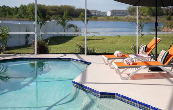 Sun-drenched pool area with comfortable loungers for ultimate chill time.