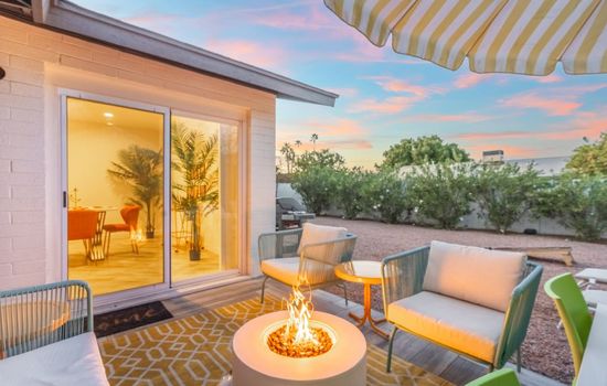 Outside patio and dining area with fireside table for relaxing during your stay at Hermosa House. Kick back and relax while enjoying those amazing Arizona evenings while sipping your favorite beverage.