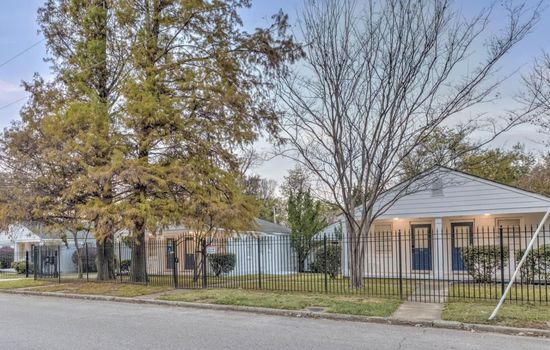 Gorgeous street view of the gated community and it's blue entrance doors.