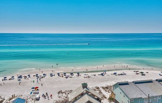 The beach is calling, and Okaloosa Island is only 10 minutes away—time to trade your shoes for sand!