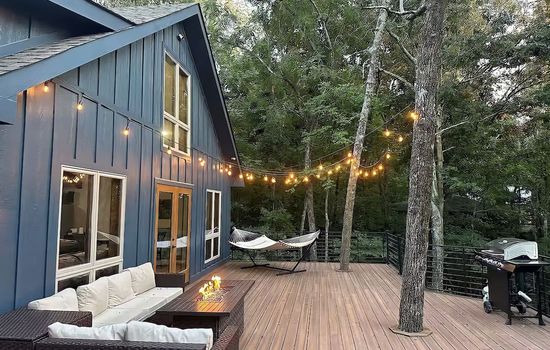 The Hickory Hideaway features a large back deck perfect for relaxing and enjoying beautiful sunset views.