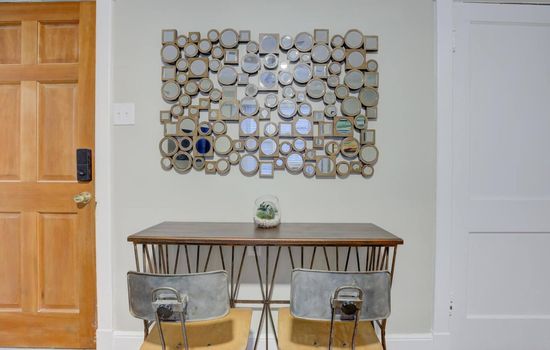A modern, industrial corner perfect for breakfast, dinner, or a glass of wine for two.