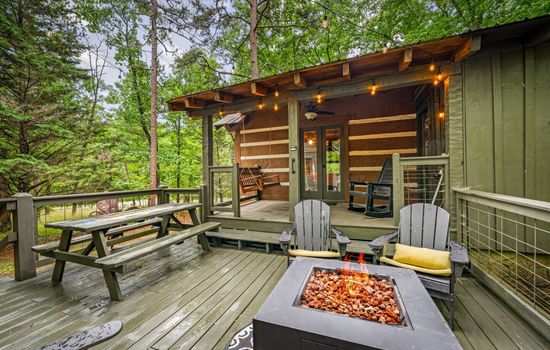 Who needs Wi-Fi when you’ve got a fire pit and the woods for company?