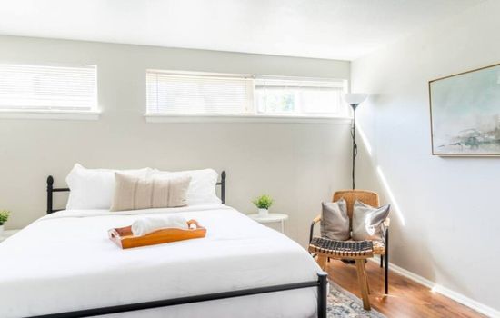 Wake up refreshed in this calm, sunlit queen bedroom.
