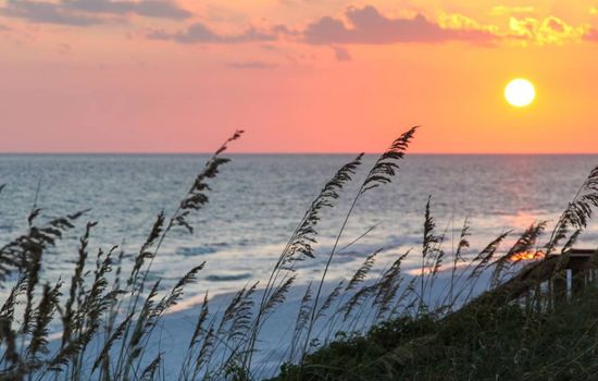 Crystal-clear waters and sunsets! Enjoy swimming, sunbathing, or a peaceful stroll along June White Decker Beach.