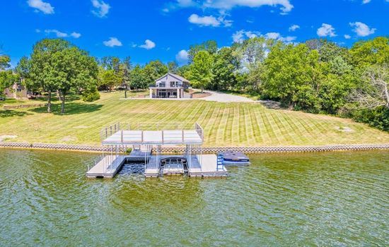 KC's Only Lake House w/ Dock and Sport Court!