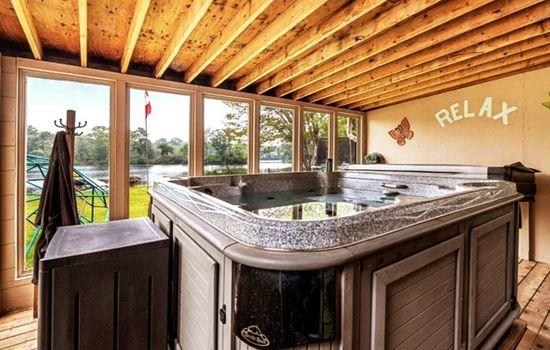 Hot Tub with view of the beautiful Gull River.