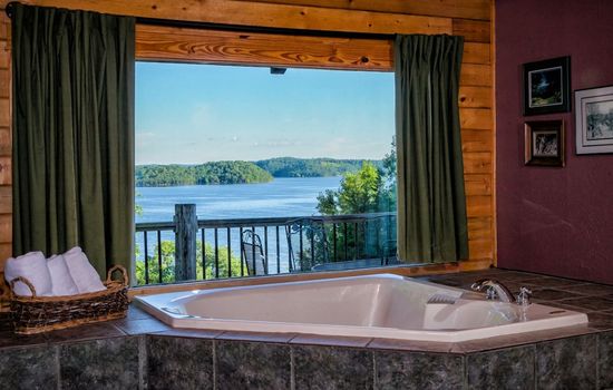 Master Bathroom with Large Jacuzzi and lake view.