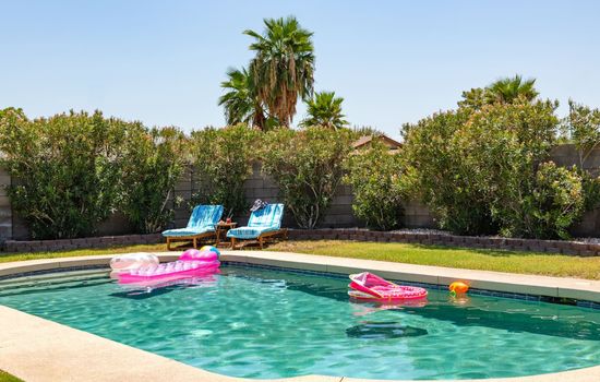 The backyard provides a private sun soaked oasis featuring a private pool and gas propane BBQ.