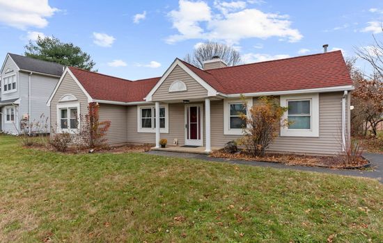 Exterior view of the home with classic siding and warm tones.
