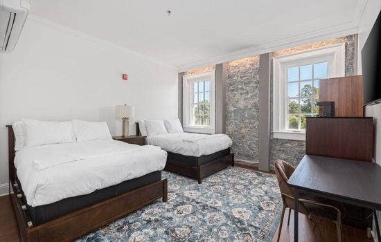 This is the private room you will be renting featuring two comfortable double beds and bright natural light.