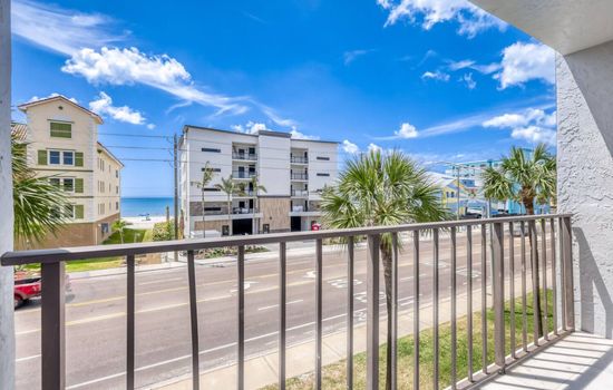 Private balcony with partial water views and fresh coastal air.