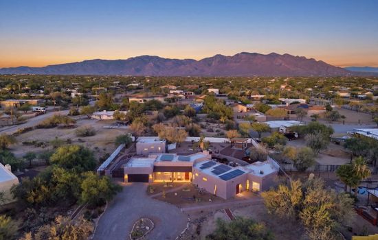 Aerial view showcasing the property and surrounding mountain views.