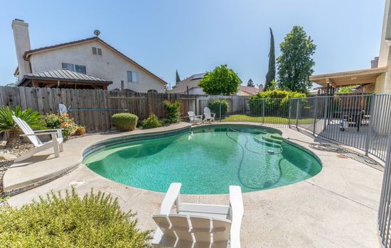 Private backyard pool perfect for sunny afternoons and relaxing swims.