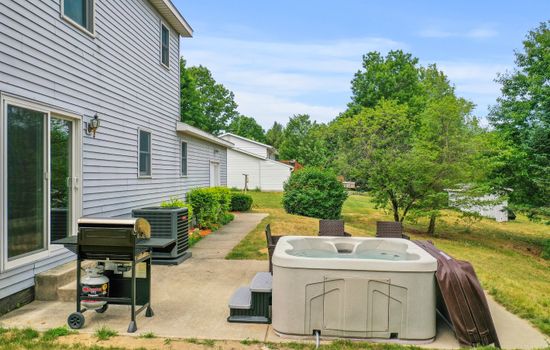 Outdoor Escape: Unwind in the hot tub or fire up the grill amid serene natural beauty!