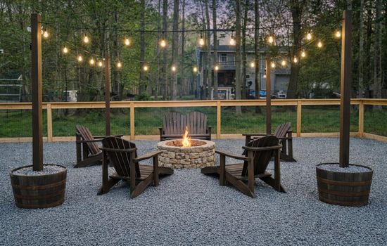 Outdoor Firepit: Gather around the fire under twinkling lights for stories and s'mores!