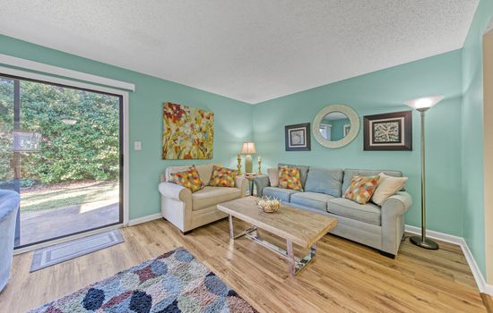 Living Room: Vibrant hues and inviting decor create the perfect retreat after a day in the sun!