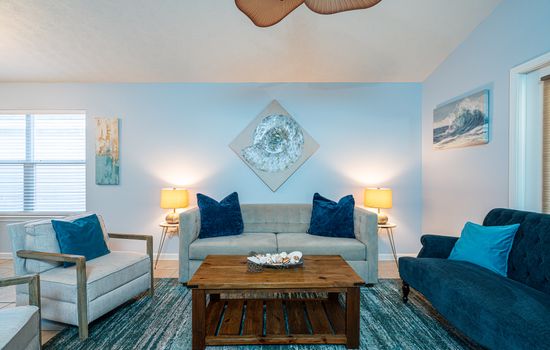 Living Room: Vibrant colors and beach vibes, perfect for relaxation and movie nights!