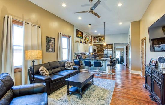 12 foot ceilings, open floor plan, original hardwood floors, stainless steel ceiling fans