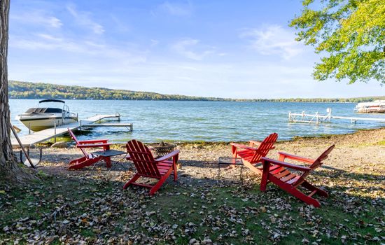 Lakeside fire pit with Adirondack chairs