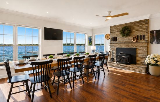 Lakeview dining area beside the stone fireplace