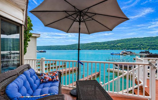 Umbrella-shaded patio overlooking the lake