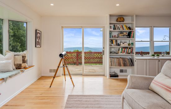 Telescope positioned between large windows