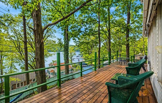 Furnished wooden deck overlooking the lake