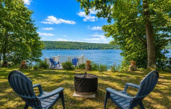 Lakeside fire pit with Adirondack chairs