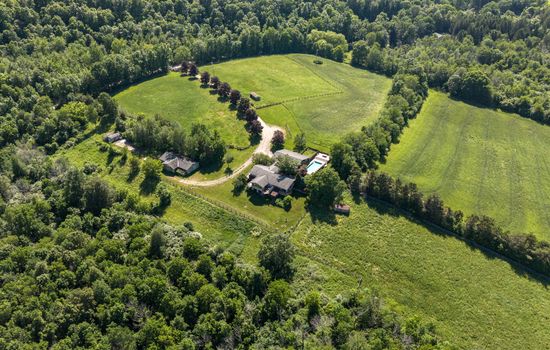 Aerial view of the home and surrounding grounds