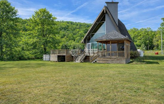 A-frame home with expansive front lawn