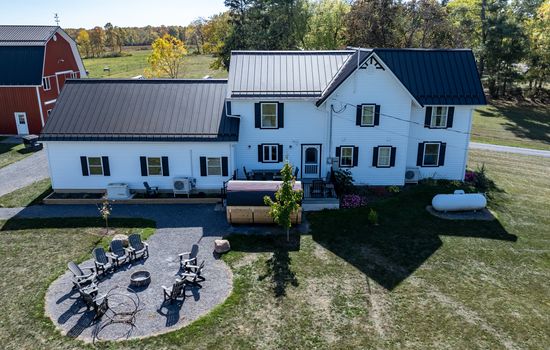 Aerial view of farmhouse and patio