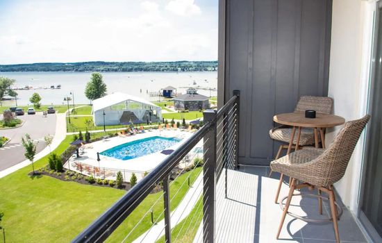 Private balcony overlooking the pool and lake
