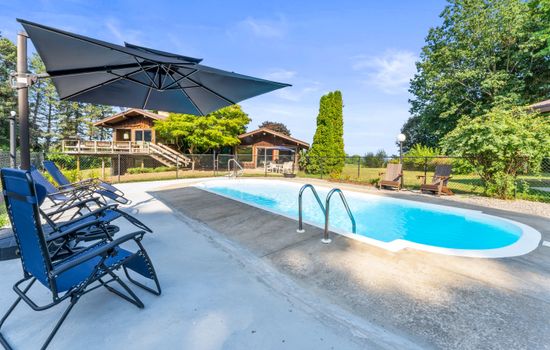 Poolside seating with shaded lounge area