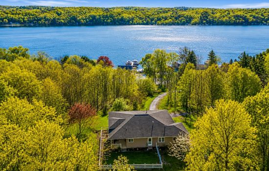 Aerial view of the home and nearby lake