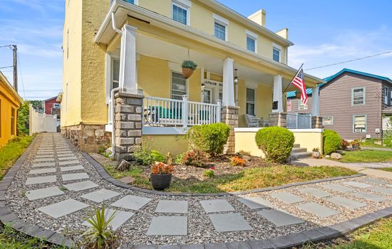 Landscaped walkway leading to the front porch