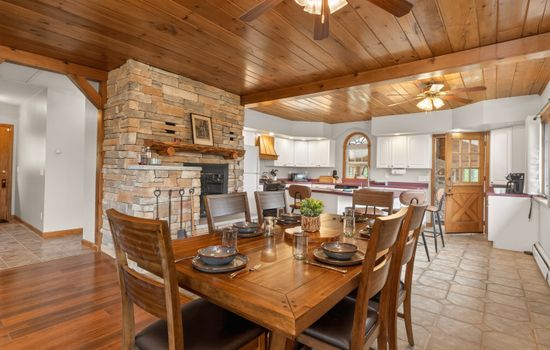 Dining area beneath exposed wooden beams