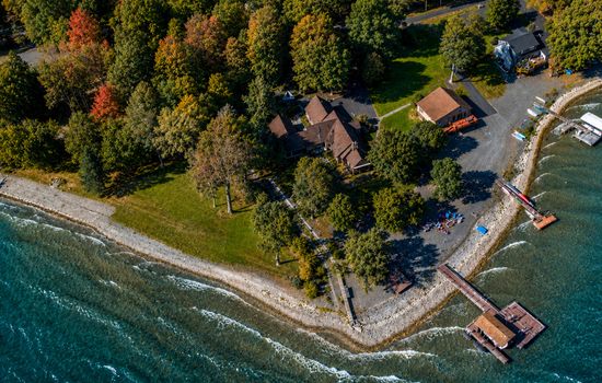 Aerial view of the lakefront property and dock