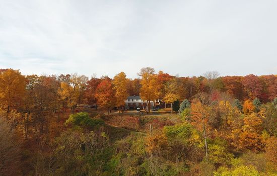Aerial view of the home in autumn
