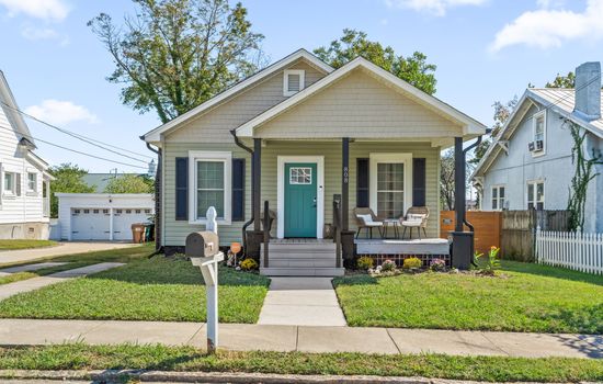 Charming front exterior w/ classic curb appeal, inviting porch, & a warm welcome from the moment you arrive.